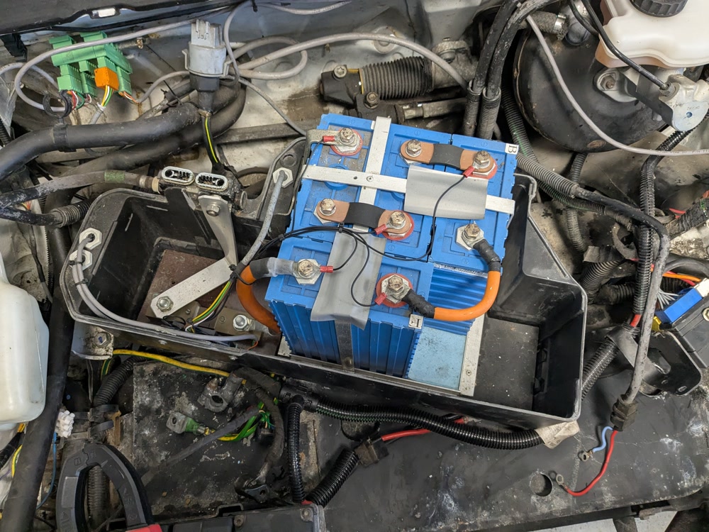 opened battery casing showing 4 LiFePO4 batteries